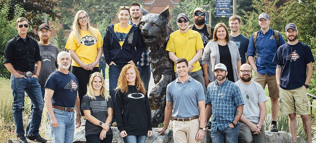 Veteran Serveries staff and MSU student veterans gather for a photo at Alumni Plaza.