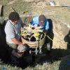 Team installing underground components