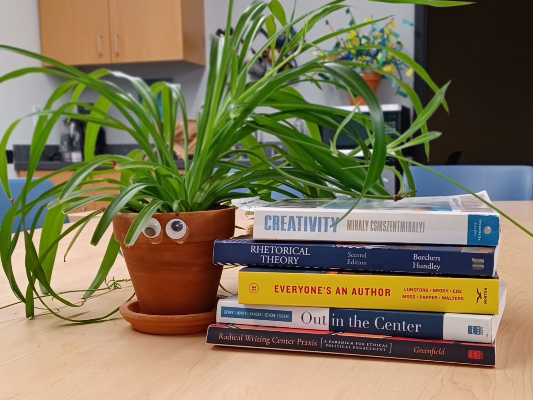 Photo of books with plant